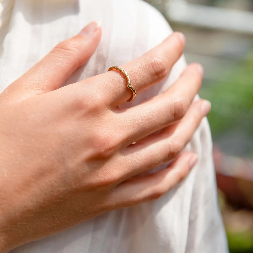 V-Shaped Ring with Scattered Diamonds